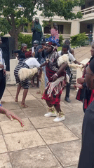 Traditional performance and gathering in a Jos courtyard