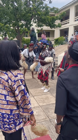 Traditional performance and gathering in a Jos courtyard