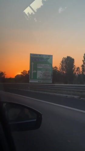 Driver captures vibrant sunset on Rome highway