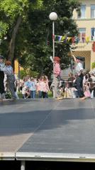 Children perform synchronized dance routine on outdoor stage in Varna