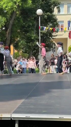 Children perform synchronized dance routine on outdoor stage in Varna