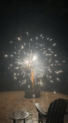 Backyard fireworks light up a stone patio in Mineral, Virginia