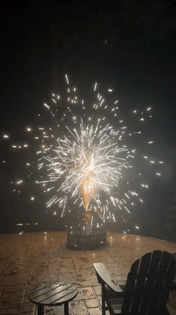 Backyard fireworks light up a stone patio in Mineral, Virginia