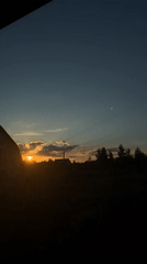 Summer sunset over a quiet Ukrainian village, with everyday details.