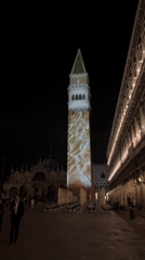 Light projection displays on Venice's St. Mark's Campanile at night