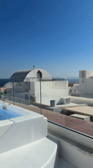 Morning jacuzzi view captured overlooking Aegean Sea in Santorini