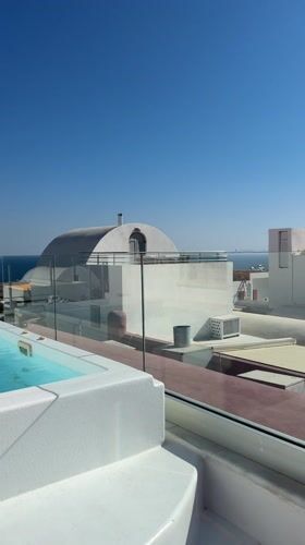 Morning jacuzzi view captured overlooking Aegean Sea in Santorini