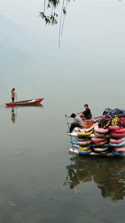 Paddle boarders create floating structure on Pokhara lake