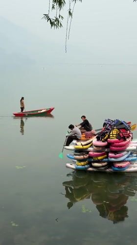 Paddle boarders create floating structure on Pokhara lake