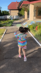 Child plays at Ukrainian village playgrounds during morning hours