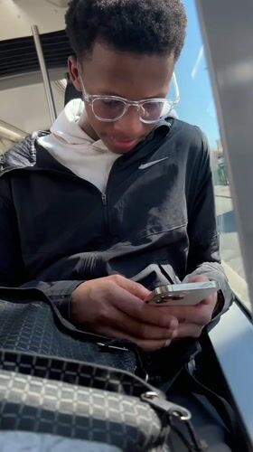 Commuter uses phone on Strasbourg public transport