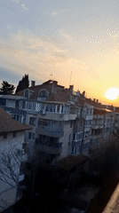 Sunset over residential buildings documented in Burgas, Bulgaria