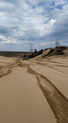Dirt bike rider navigates sandy dunes in Belarus