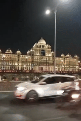 Ornate domed building illuminated at night in Hyderabad