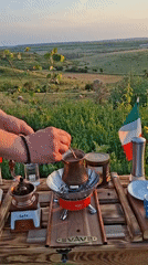 Hand-ground coffee at sunset in a Moldovan field