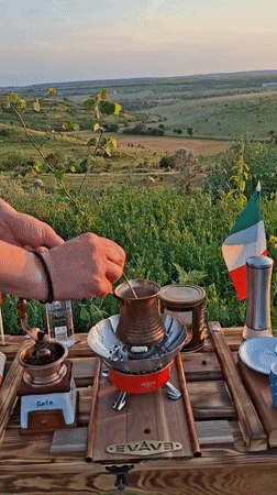 Hand-ground coffee at sunset in a Moldovan field