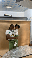 Photography session captures NYSC member with child in Nigeria