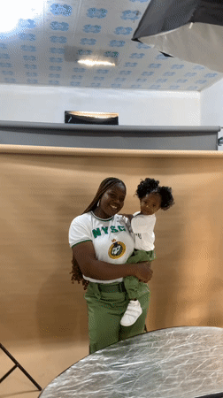 Photography session captures NYSC member with child in Nigeria