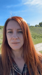 Woman films herself by river in Ust-Koksa, Russia
