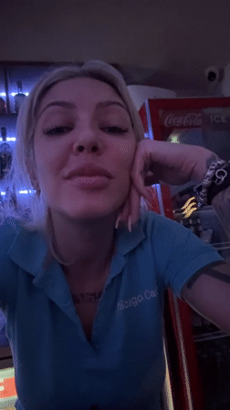 Woman poses at busy restaurant in Plovdiv, Bulgaria