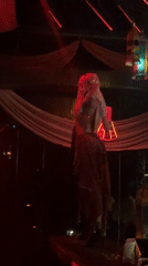 Belly dancer performs on nightclub bar in North Kuta