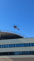 Medical helicopter lands on Heidelberg rooftop helipad