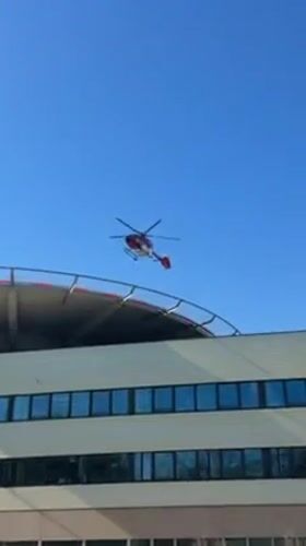 Medical helicopter lands on Heidelberg rooftop helipad