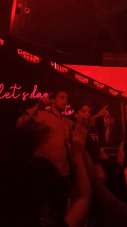 Club scene captured in Liangjiang with dancing crowd