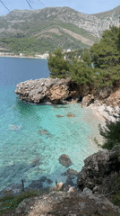 Father and child visit secluded beach in Sutomore, Montenegro
