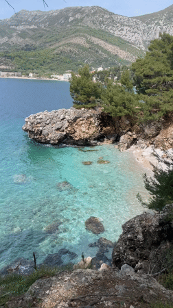 Father and child visit secluded beach in Sutomore, Montenegro