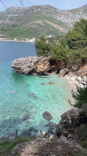 Father and child visit secluded beach in Sutomore, Montenegro