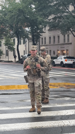 National Guard soldiers deployed on rainy Washington street
