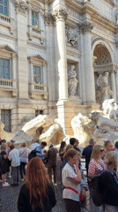Crowds gather at Rome's Trevi Fountain on sunny afternoon