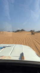 Vehicle passenger captures sand dune vista in Phuoc Dinh