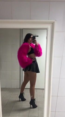Woman takes mirror selfies in pink jacket in Kazan