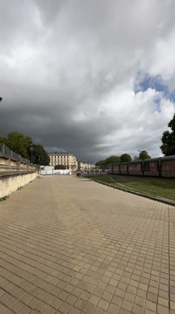 Bordeaux waterfront on a summer morning — trams, tourists, and cruise ships