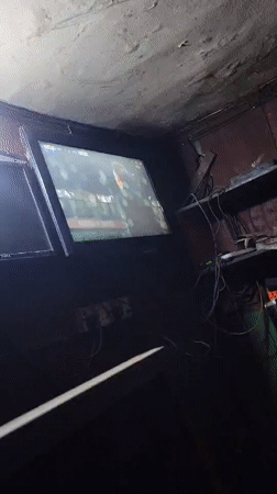 Men gather in Nkpor room to watch Arsenal-Atletico soccer match
