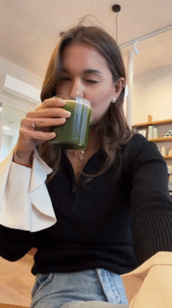 Woman enjoys café refreshments, takes selfies in Lyon establishment