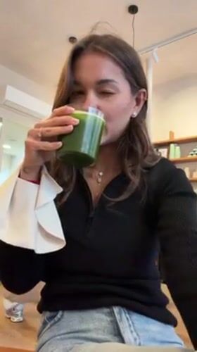 Woman enjoys café refreshments, takes selfies in Lyon establishment