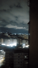 Caracas resident documents nighttime city views and domestic moments