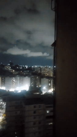 Caracas resident documents nighttime city views and domestic moments