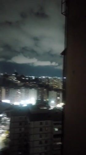 Caracas resident documents nighttime city views and domestic moments
