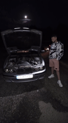 Car breakdown attended to by two men in Pushevo