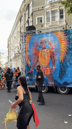 London street carnival draws crowds in colorful costumes and body paint