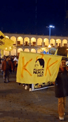 Nighttime protest with yellow banners documented in Arequipa, Peru