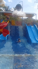 Children enjoy water park activities in Denpasar swimming pool
