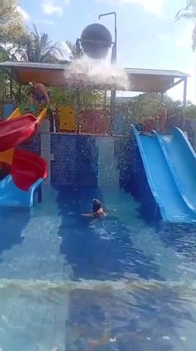 Children enjoy water park activities in Denpasar swimming pool