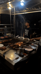 Night grilling operation documented at North Kuta food stall