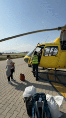 Woman observed at Kathmandu helipad under clear skies