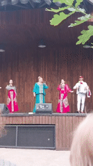 Outdoor musical concert performed on wooden stage in Orenburg